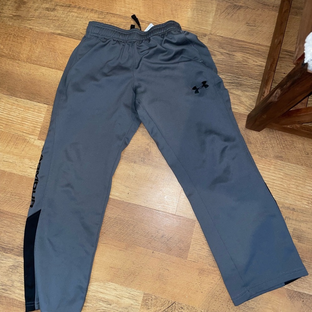 3 paid of boys sweat pants, under armor; Russel; and Athletic works